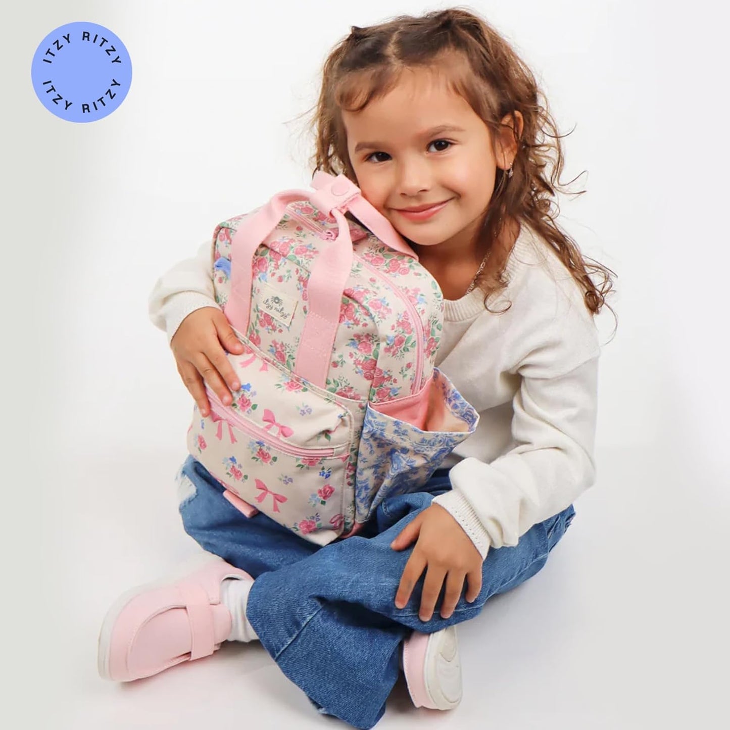Itzy Ritzy Toddler Backpack - Daycare Bag - Features Adjustable Shoulder Straps, 2 Side Pockets & Spacious Interior with Wipeable Fabric Lining & Name Label, Strawberry Backpack