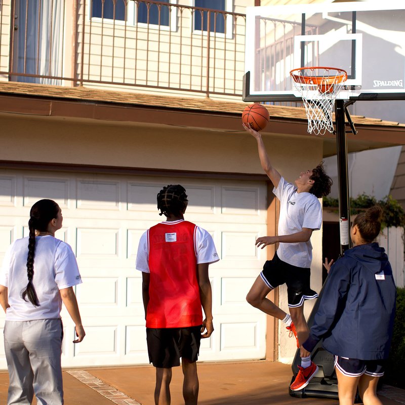 Spalding The Ultimate Hybrid, 54" Glass, Alum Trim, 3 Piece 4" Pole, Screw Jack Lift, Arena Slam Rim, Board Pad- Hybrid