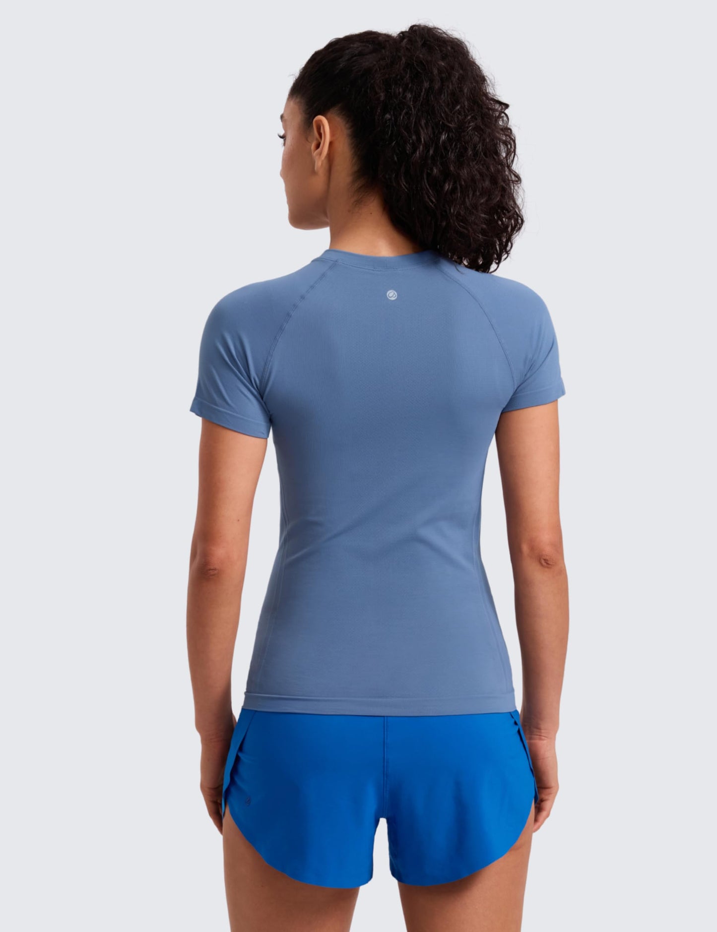 CRZ YOGA Seamless Workout Tops for Women Hip Length - Athletic Running Gym Yoga Short Sleeve Shirts Breathable Crewneck Tees Oasis Blue Small