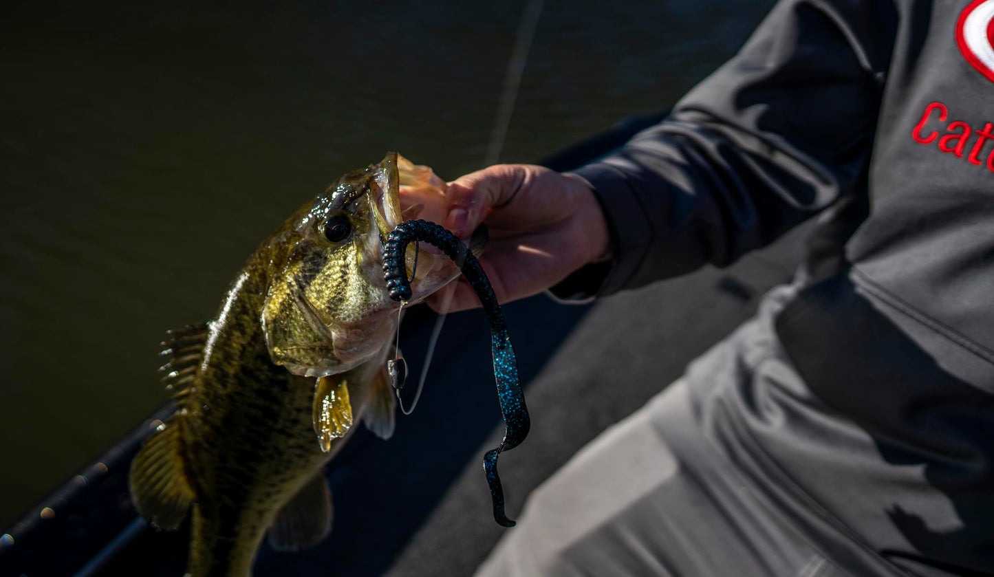 Berkley PowerBait® Power Worm Fishing Bait, Black Blue Fleck, 7in | 18cm, Irresistible Flavor, Classic Curly Tail Worm Profile, Ideal for Spring, Summer and Fall Fishing