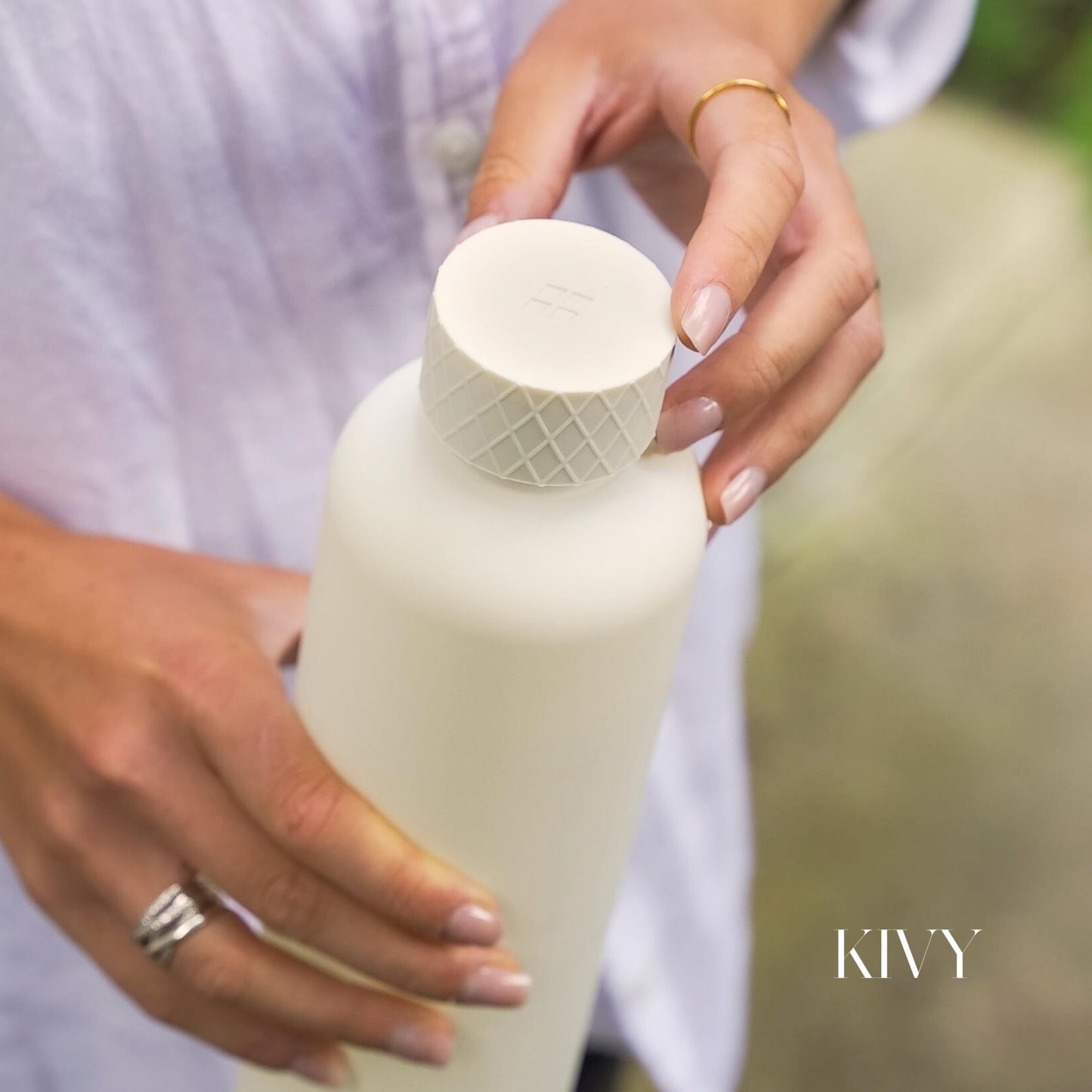 KIVY Slim Water Bottle 32oz [Lightweight & Shatterproof Tritan] Fits Backpack & Cupholder for Travel, Sports, School, Gym - Clear water bottle with measurements - Transparent Beige - Dishwasher Safe