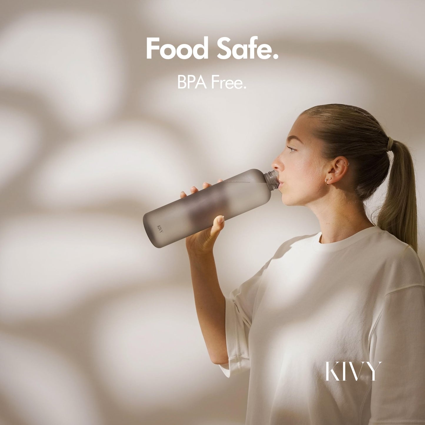 KIVY Slim Water Bottle 32oz [Lightweight & Shatterproof Tritan] Fits Backpack & Cupholder for Travel, Sports, School, Gym - Clear water bottle with measurements - Transparent Beige - Dishwasher Safe