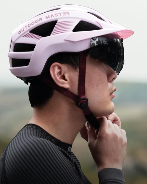 OutdoorMaster Helmets for Adults - Mountain & Road Bike Helmet with Rechargeable Safety Light, Detachable Goggles and Sun Visor - Easy to Adjust, Breathable, Lightweight - Medium