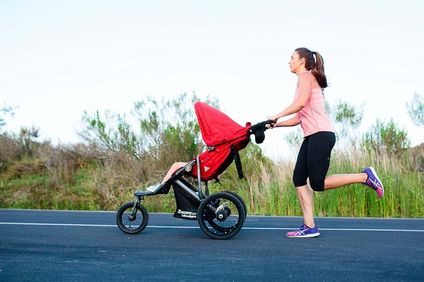 Joovy Zoom360 Ultralight Jogging Stroller Featuring High Child Seat, Shock-Absorbing Suspension, Extra-Large Air-Filled Tires, Parent Organizer, Air Pump, and Easy One-Hand Fold (Red)